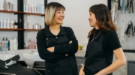 hairstylist-colleagues-talking-with-each-other-2023-11-27-05-19-39-utc-min-scaled.jpg
